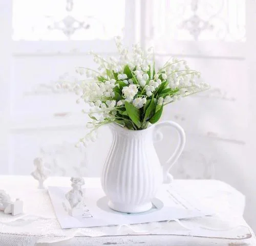 The proportion of lily of the valley sticking out of the vase